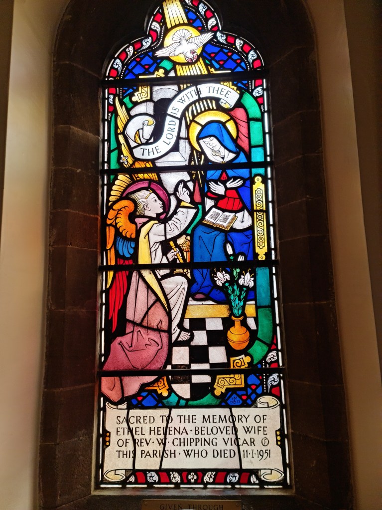 Stained glass window in the Lady Chapel.  "Sacred to the memory of Ethel Helena, beloved wife of Rev W Chipping Vicar of this parish who died 11.1.1951